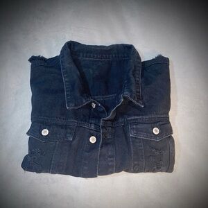 Distressed black denim jacket.